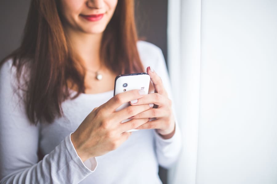 A parent sharing a pot link from her phone